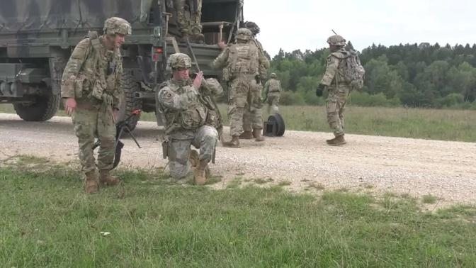 Soldiers from D company 1-214 GSAB prepare a wrecked helicopter to be ...