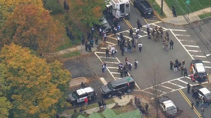 Police Shooting Suspect Taken Into Custody After Manhunt 