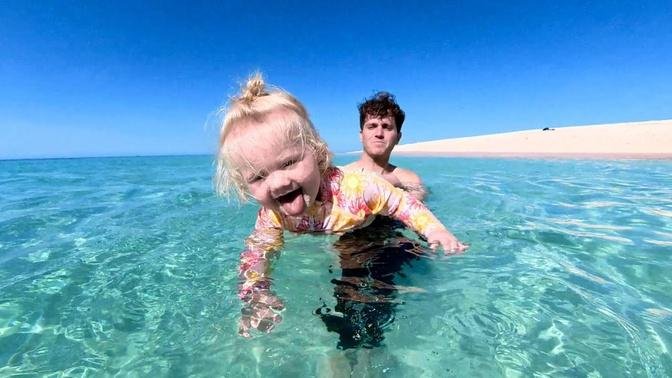 BABY LEARNS TO SWIM in the GREAT BARRIER REEF.