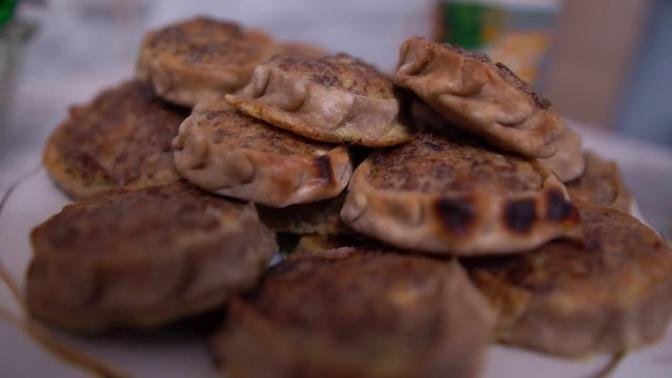 Making traditional Udmurt pies. Russian nations cuisine and village life in Russia.