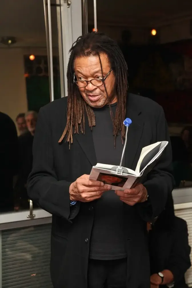 Quincy Troupe reads from his poetry during the launch of...